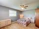 Bedroom with wood floors and mini fridge at 4300 41St N St, St Petersburg, FL 33714