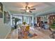 Bright sunroom features a table, chairs, and a home office area with window views at 2447 Nantucket Harbor Loop # 112, Sun City Center, FL 33573
