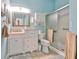 Clean bathroom with a walk-in shower, vanity, and toilet at 2447 Nantucket Harbor Loop # 112, Sun City Center, FL 33573