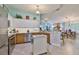 Modern kitchen with an island, stainless steel appliances, and a breakfast bar at 2447 Nantucket Harbor Loop # 112, Sun City Center, FL 33573
