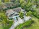 Aerial view of single Gathering home with driveway and landscaping at 2447 Nantucket Harbor Loop # 112, Sun City Center, FL 33573