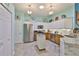 Modern kitchen with stainless steel appliances and a large island at 2447 Nantucket Harbor Loop # 112, Sun City Center, FL 33573