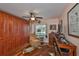 Home office with built-in wooden cabinets and a comfortable recliner at 2447 Nantucket Harbor Loop # 112, Sun City Center, FL 33573