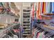 Large walk-in closet with ample shelving and hanging space at 2447 Nantucket Harbor Loop # 112, Sun City Center, FL 33573
