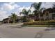 Community clubhouse with palm trees and parking lot at 2447 Nantucket Harbor Loop # 112, Sun City Center, FL 33573