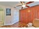 Bedroom with built-in wooden cabinets and a view of another bathroom at 2447 Nantucket Harbor Loop # 112, Sun City Center, FL 33573