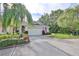 Single-story home with attached garage and landscaped yard at 2447 Nantucket Harbor Loop # 112, Sun City Center, FL 33573