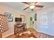 Home office with a wooden desk, chairs, and a cowhide rug at 2447 Nantucket Harbor Loop # 112, Sun City Center, FL 33573