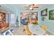 Sunroom offers a relaxing space with a round table and chairs, and an open view to the living room at 2447 Nantucket Harbor Loop # 112, Sun City Center, FL 33573