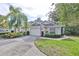 Front view of charming house with American flags at 2447 Nantucket Harbor Loop # 112, Sun City Center, FL 33573