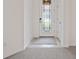 Entryway with carpeted floor, and glass door at 5115 Tobermory Way, Bradenton, FL 34211