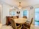 Cozy dining area with a wood table and four chairs at 35801 Verda Dr, Zephyrhills, FL 33541