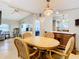 Dining room with a wood table and chairs, buffet, and access to other rooms at 35801 Verda Dr, Zephyrhills, FL 33541