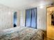 Bedroom with a bed and access to another room at 35801 Verda Dr, Zephyrhills, FL 33541