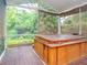 Relaxing hot tub on a screened porch overlooking a private backyard at 210 Nw Lincoln N Cir, St Petersburg, FL 33702