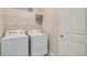 Convenient laundry room with side-by-side washer and dryer at 5809 Silver Feather Way, Palmetto, FL 34221