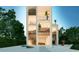 Modern, three-story home with glass and wood accents at 100 Shore Dr, Tarpon Springs, FL 34689