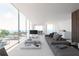 Spacious living area with floor-to-ceiling windows and ocean views at 100 Shore Dr, Tarpon Springs, FL 34689