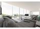 Open concept living space with stunning water views and modern furniture at 100 Shore Dr, Tarpon Springs, FL 34689