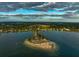 Aerial view of waterfront property near island at 100 Shore Dr, Tarpon Springs, FL 34689
