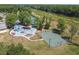 Aerial view of community amenities including playground, basketball court, and tennis courts at 6527 Stonington Dr, Tampa, FL 33647