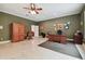 Bright home office with wood desk, built-in cabinetry, and hardwood floors at 6527 Stonington Dr, Tampa, FL 33647