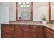 Granite countertop vanity with sink and large mirror in bathroom at 6527 Stonington Dr, Tampa, FL 33647