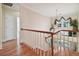 Upstairs hallway overlooking entryway and staircase at 6527 Stonington Dr, Tampa, FL 33647