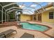 Enclosed pool and spa with adjacent patio at 6527 Stonington Dr, Tampa, FL 33647