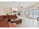 Bright living room featuring a fireplace and French doors leading to patio at 6527 Stonington Dr, Tampa, FL 33647