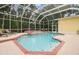 Enclosed pool and spa with a view of the house at 6527 Stonington Dr, Tampa, FL 33647