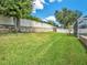 Landscaped yard with retaining wall at 2816 Rolling Acres Pl, Valrico, FL 33596