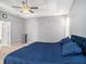 Main bedroom with king-size bed, carpet flooring, and ceiling fan at 2816 Rolling Acres Pl, Valrico, FL 33596