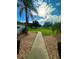 Sidewalk leading through a landscaped yard at 12384 Creek Edge Dr, Riverview, FL 33579