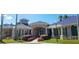 Beautiful clubhouse with architectural details, landscaped grounds, and covered entryways for community members at 18122 Sugar Brooke Dr, Tampa, FL 33647