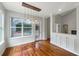 Light-filled dining area with backyard pool view and modern pendant lighting at 18122 Sugar Brooke Dr, Tampa, FL 33647