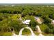 Aerial view of a house with a pool and large yard at 29249 Wilpayne Rd, Brooksville, FL 34602