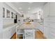 Modern kitchen boasting white cabinets, granite countertops and island at 29249 Wilpayne Rd, Brooksville, FL 34602