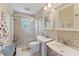 Clean bathroom with double sinks, shower, and updated fixtures at 29249 Wilpayne Rd, Brooksville, FL 34602