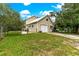Detached garage with a side view showcasing double doors at 29249 Wilpayne Rd, Brooksville, FL 34602