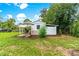 Charming backyard shed with pergola and patio area, ideal for gardening at 29249 Wilpayne Rd, Brooksville, FL 34602