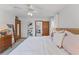 Main bedroom with king bed, view of attached bath, and ample light at 29249 Wilpayne Rd, Brooksville, FL 34602