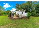 Well-maintained shed with pergola and patio furniture, perfect for outdoor relaxation at 29249 Wilpayne Rd, Brooksville, FL 34602