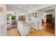 Open concept kitchen with white cabinets, granite countertops and island at 29249 Wilpayne Rd, Brooksville, FL 34602