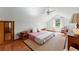 Spacious bedroom with hardwood floors and a ceiling fan at 29249 Wilpayne Rd, Brooksville, FL 34602