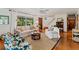 Living room with hardwood floors, fireplace and seating at 29249 Wilpayne Rd, Brooksville, FL 34602