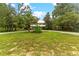 House with a palm tree and grassy front yard at 29249 Wilpayne Rd, Brooksville, FL 34602