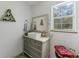 Charming bathroom with a modern vanity and a vintage dresser at 29249 Wilpayne Rd, Brooksville, FL 34602