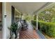 Inviting front porch with rocking chairs and landscaping at 29249 Wilpayne Rd, Brooksville, FL 34602