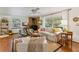 Living room with hardwood floors, fireplace and seating at 29249 Wilpayne Rd, Brooksville, FL 34602